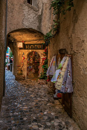 Saint-Paul-de-Vence, France - July 13, 2016. View of narrow alley with shop in the village of Saint-Paul-de-Vence, stunning medieval town completely preserved. In Provence region, southeastern Franceのeditorial素材