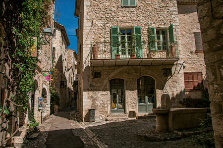 Saint-Paul-de-Vence, France - July 13, 2016. Alley with square, stone houses and fountain in Saint-Paul-de-Vence, stunning medieval town completely preserved. In Provence region, southeastern Franceのeditorial素材