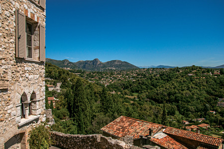 Panoramic view of hills and facade of building in Saint-Paul-de-Vence, a lovely well preserved medieval hamlet near Nice. Located in Alpes-Maritimes department, Provence region, southeastern Franceのeditorial素材