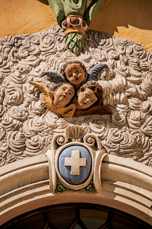 View of sculpture of faces of angels on church facade of Vence, a stunning medieval hamlet completely preserved. Located in the Alpes-Maritimes department, Provence region, southeastern Franceのeditorial素材