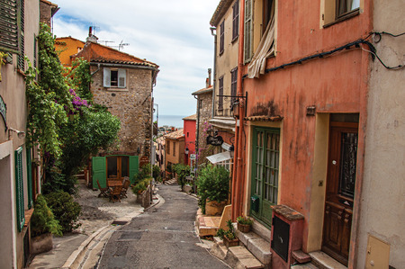 Haut-de-Cagnes, France - July 14, 2016. View of alley with houses in Haut-de-Cagnes, a pleasant village on top of a hill, near Nice. In Alpes-Maritimes department, Provence region, southeastern Franceのeditorial素材