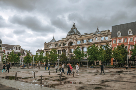 Antwerp, Northern Belgium - July 02, 2017. Square with people and old buildings in rainy day at Antwerp. Port and multicultural metropolis, it is known as one of the main gateways for goods in Europe.のeditorial素材