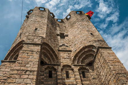 Close-up of stone watch-tower and flag in the Gravensteen Castle at Ghent. In addition to intense cultural life, the city is full of Gothic buildings and Flemish style architecture. Northern Belgium.のeditorial素材