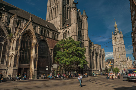 Ghent, Belgium - July 03, 2017. People, old buildings and Gothic cathedral in Ghent. In addition to intense cultural life, the city is full of canals and Flemish architecture. Northern Belgium.の写真素材
