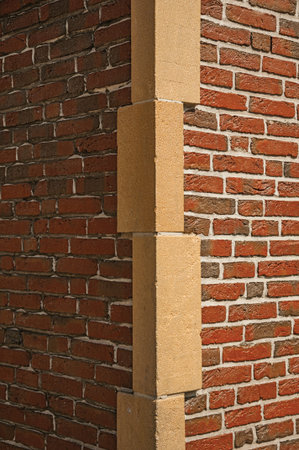 Close-up of brick wall and stone forming the corner of a building in Brussels. Vibrant and friendly, is the country's capital and administrative center of the EU. Central Belgium.のeditorial素材