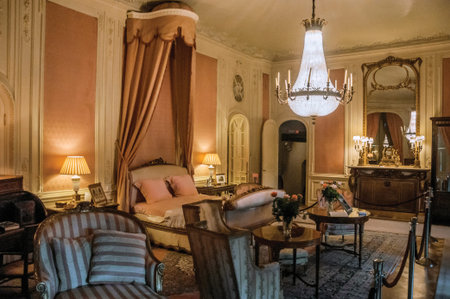 Furniture in luxurious De Haar Castle bedroom, near Utrecht. Of medieval origin, it underwent...