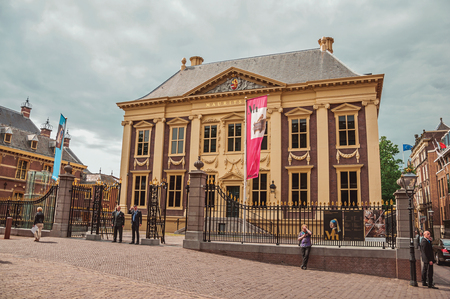 People and Mauritshuis House, museum with Dutch Golden Age paintings at The Hague. Important political center, is a mix of historic city with modernity.のeditorial素材