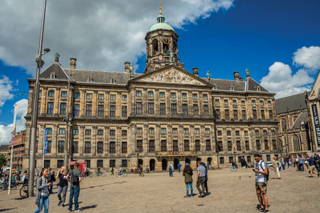 Amsterdam, northern Netherlands - June 26, 2017. Square and people in front of the Royal Palace of Amsterdam. The city is famous for its huge cultural activity, graceful canals and bridges.のeditorial素材