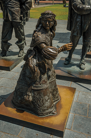 Bronze sculpture of female child on the Rembrandt Square in a sunny day at Amsterdam. The city is famous for its huge cultural activity, graceful canals and bridges. Northern Netherlands.のeditorial素材