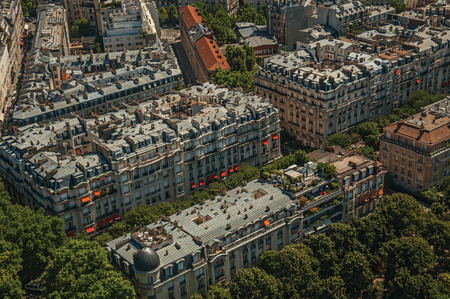 Streets, greenery and buildings in a sunny day, seen from the Eiffel Tower in Paris. Known as the "City of Light", it is one of the most impressive cultural centers in the world. Northern France.の写真素材