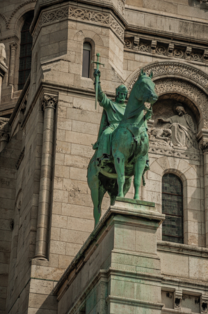 Bronze equestrian statue at the Basilica of Sacre Coeur facade in Paris. Known as the "City of Light", it is one of the most impressive cultural centers in the world. Northern France.の写真素材