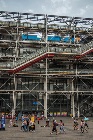Paris, northern France - July 09, 2017. Facade and escalator on the Georges Pompidou Center in cloudy day at Paris. Known as the "City of Light", it is one of the most impressive cultural centers in the world.のeditorial素材