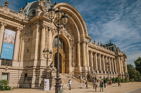 Paris, France - July 11, 2017. People and staircase at the Golden Gate of Petit Palais at Paris. Known as the "City of Light", it is one of the most impressive cultural centers in the world. Northern France.のeditorial素材