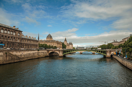 Historical buildings and bridge on the Seine River in Paris. Known as the "City of Light", it is one of the most impressive cultural centers in the world.の写真素材