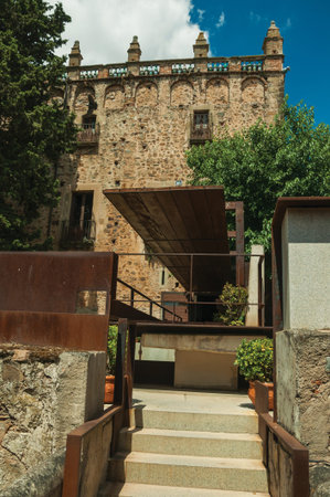 Caceres, Spain - July 03, 2018. Old building and modern gardens of the Caceres Museum in sunny day...