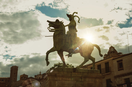 Pizarro equestrian statue on the sunshine at the Plaza Mayor (Main Square) of Trujillo. A small medieval town, birthplace of the Conquistador Francisco Pizarro in western Spain. Retouched photo.の写真素材