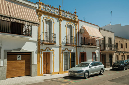 Merida, Spain - July 05, 2018. Ornate and colorful buildings with balconies and awnings in a street...
