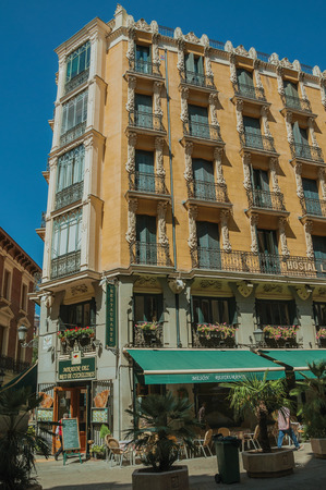Madrid, Spain - July 24, 2018. Charming old building with eatery and people walking on a calm street in Madrid. Capital of Spain this charming metropolis has vibrant and intense cultural life.のeditorial素材