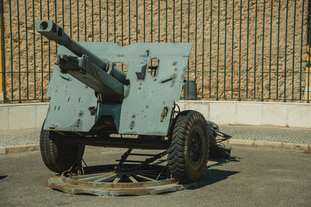Elvas, Portugal - July 07, 2018. Outdated artillery piece in front of iron fence at the Military Museum of Elvas. A gracious star-shaped fortress city on the easternmost frontier of Portugal.のeditorial素材