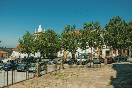 Castelo de Vide, Portugal - July 10, 2018. Old houses in a deserted square with cars, on sunny day at Castelo de Vide. Nice little town with medieval castle for the defense of Portugal eastern border.のeditorial素材