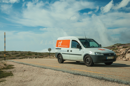 Serra da Estrela, Portugal - July 12, 2018. Car passing through road on rocky landscape at the Serra da Estrela ridge. The highest mountain range in continental Portugal, with astonishing scenery.のeditorial素材