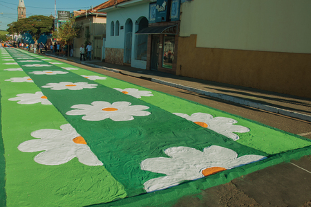 Sao Manuel, Brazil - May 31, 2018. Artistic colorful sand carpet made by the devotees for the celebration of Holy Week on the street of Sao Manuel. A little town in the countryside of Sao Paulo State.のeditorial素材