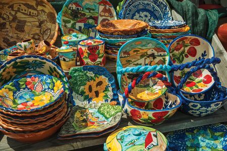 Colorful handmade porcelain pots and dishes, typical of the region, in a gift shop at the Serra da Estrela. The highest mountain range in continental Portugal, with astonishing scenery.の写真素材