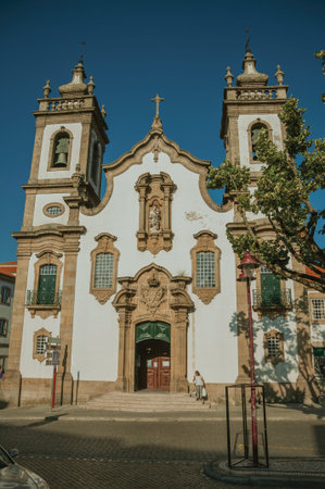 Guarda, Portugal - July 18, 2018. Church of the Misericordia in baroque style and people on a square of Guarda. This friendly and well-kept medieval town is the highest in the continental Portugal.のeditorial素材
