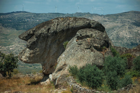 Rock formation that looks like the head profile of an old woman on top of hill, in a sunny day at...