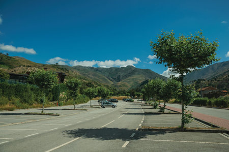 Unhais da Serra, Portugal, July 15, 2018. Large parking lot with hilly landscape at Unhais da Serra....