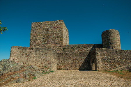 Marvao, Portugal - July 09, 2018. People walking in front of stone walls and towers, on sunny day at the Marvao Castle. An amazing medieval fortified village perched on a crag in eastern Portugal.のeditorial素材