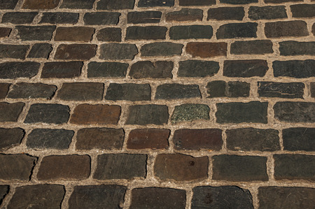 Close-up of stone sidewalk at sunset in the City Center of Ghent. In addition to intense cultural life, the city is full of Gothic and Flemish style buildings. Northern Belgium.のeditorial素材