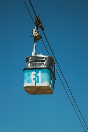 Madrid, Spain - July 24, 2018. Cable car gondola passing through clear blue sky at the Teleferico Park of Madrid. Capital of Spain this charming metropolis has vibrant and intense cultural life.のeditorial素材