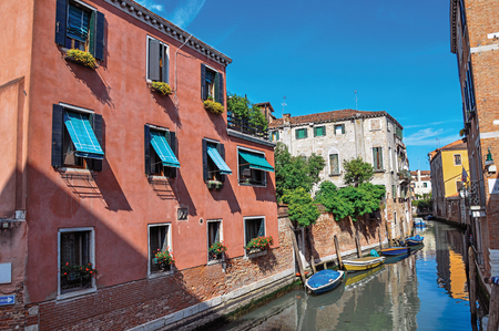 Venice, Italy - May 09, 2013. View of buildings and boats in front of a canal in a sunny day. At the city center of Venice, the historic and amazing marine city. Veneto region, northern Italyのeditorial素材