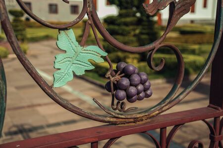 Detail of decorative grape and vine leaves forged on iron gate in a winery property near Bento Goncalves. A friendly country town in southern Brazil famous for its wine production.の写真素材