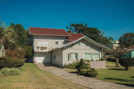 Modern country house with pathway and garden in a rural landscape near Bento Goncalves. A friendly country town in southern Brazil famous for its wine production.の写真素材