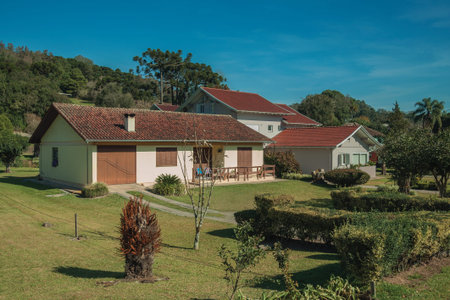 Modern country house with pathway and garden in a rural landscape near Bento Goncalves. A friendly country town in southern Brazil famous for its wine production.の写真素材