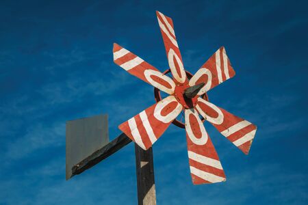 Colorful wind vane to see the speed and direction of wind, under the blue sky near Bento Goncalves. A friendly country town in southern Brazil famous for its wine production.の写真素材