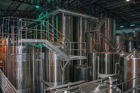 Bento Goncalves, Brazil - July 10, 2019. Steel storage tanks and equipment for wine production at Salton Winery plant near Bento Goncalves. A friendly country town famous for its wine production.のeditorial素材