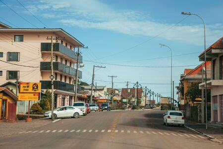 Cambara do Sul, Brazil - July 19, 2019. Townhouses, stores and light poles in the Getulio Vargas Avenue, the main street of Cambara do Sul. A small rural town with amazing natural tourist attractions.のeditorial素材