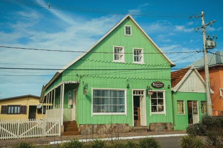 Cambara do Sul, Brazil - July 19, 2019. Wooden old houses and store in the calm Getulio Vargas Avenue, the main street of Cambara do Sul. A small rural town with amazing natural tourist attractions.のeditorial素材