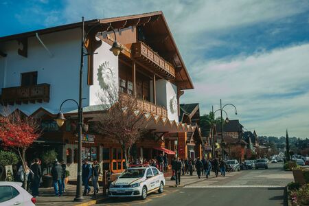 Gramado, Brazil, July 21, 2019. Charming facade from Festivals Palace and people on Borges de Medeiros Avenue, the main street of Gramado. An european-influenced town highly sought after by tourists.のeditorial素材