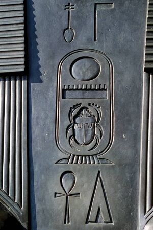 Hieroglyphic symbols carved out on rock by the ancient Egyptians in a monument placed in London. Capital of England and the United Kingdom, it is also one of the most important cities in the world.の写真素材
