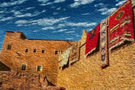 Colorful rugs hanging from a mud-built wall in an old Kasbah facade in Ouarzazate. Mainly inhabited by Berber speakers this Moroccan town is known as the desert door. Oil paint filter.のeditorial素材