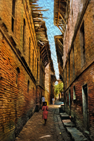 Girl walking in a narrow alley with brick buildings at Bhaktapur. An ancient village in the countryside of Nepal. Oil paint filter.の写真素材