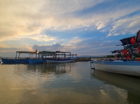 Fishing boats on the beach at sunset in IÅÄ±klÄ±, Ãivrilの写真素材