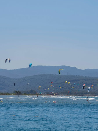 Kitesurfers in the blue sea.の写真素材