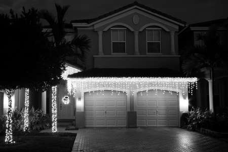 House ornamented with hanging lights for christmasの写真素材