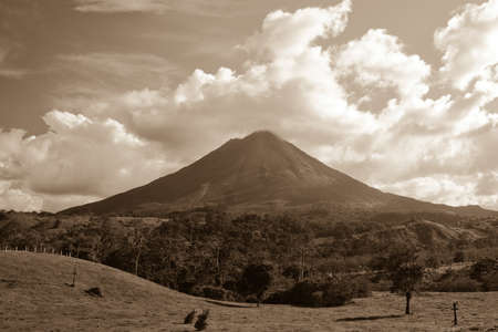 Sepia view of Arenal volcano on island of Costa Rica.の写真素材