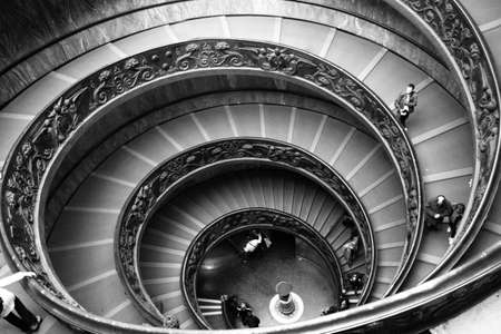 Black and white shot of ornate Spiral Stairs inside the Vatican Museum in Rome, Italyのeditorial素材